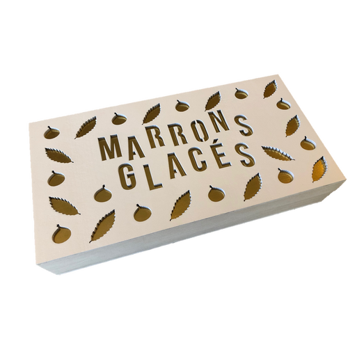 Boite de marrons glacées entiers sous papier or